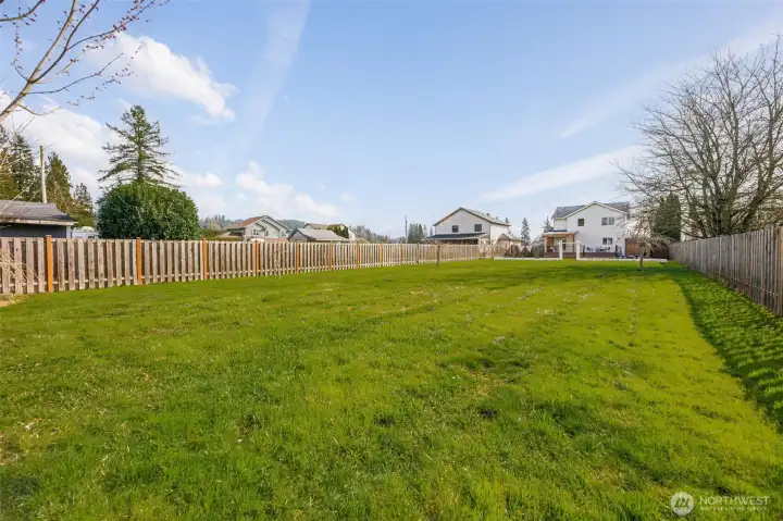 Waaaaaayyyy in the distance... there is the home! Yes, this is your HUGE, level, private yard! So easy to maintain, while providing you so much space to enjoy! No restrictions in the yard either - no water lines, septic or anything preventing your use. Some use for additional storage buildings, RV parking, or bring the entire soccer team! Add a pickleball court?!?