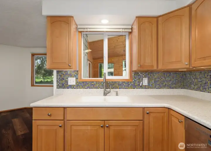 Pass-through kitchen window into the adjacent sunroom