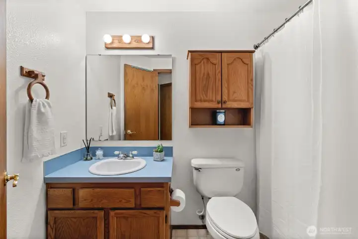 Fresh and functional. This full guest bathroom is tidy and well-cared for, offering a bright space that serves the home’s secondary bedrooms perfectly