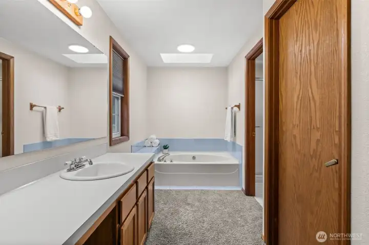 Your own personal spa. The private ensuite features a full-sized tub, offering a quiet space to relax and unwind without ever leaving the primary suite