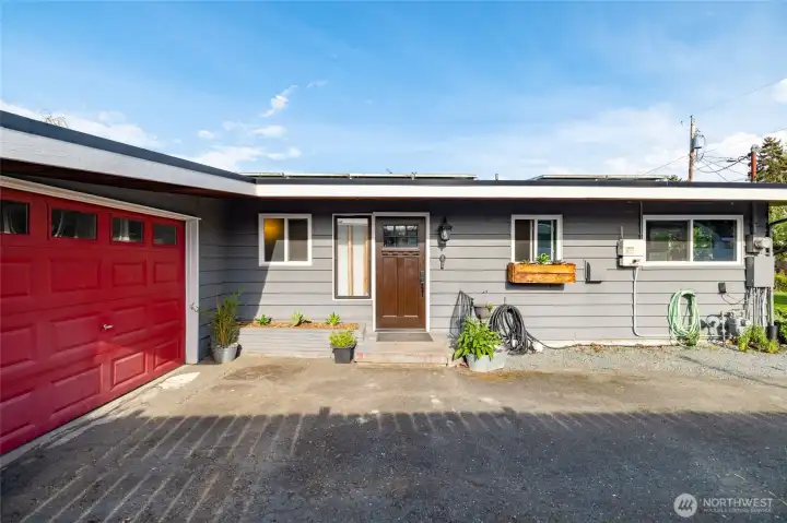 Attached garage next to front door.