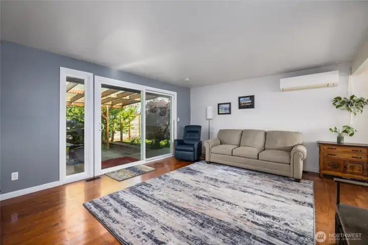 Large living room space with large sliding door to entertainment space.