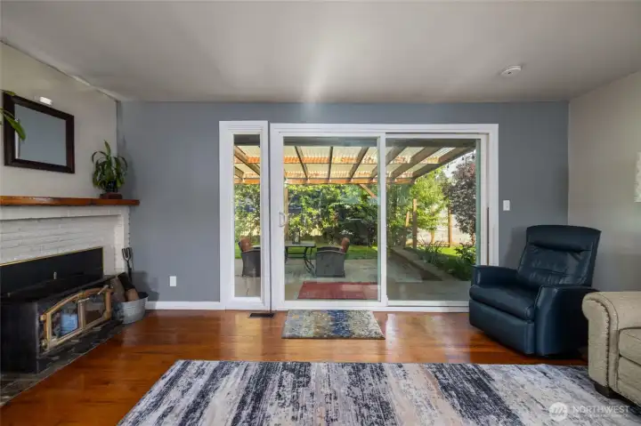 Large sliding door opens to entertaining covered patio.