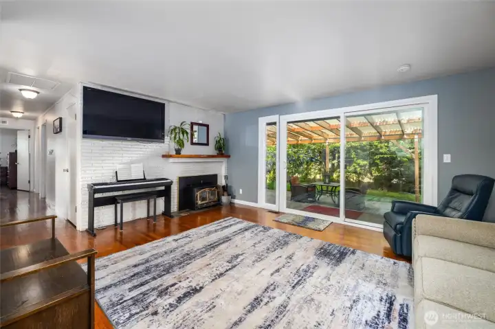 Living room features a cozy wood stove to keep warm.