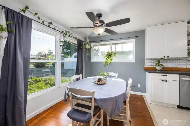 Dining room with large picture windows.