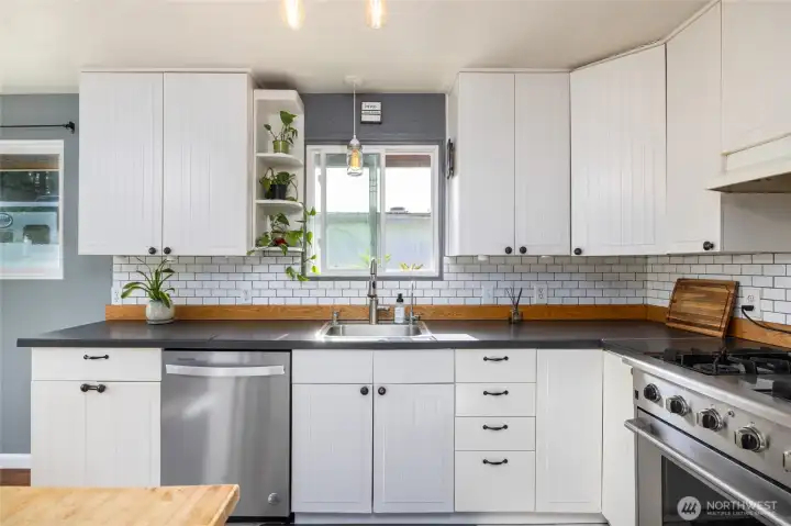 White shaker cabinets and subway tile backsplash.