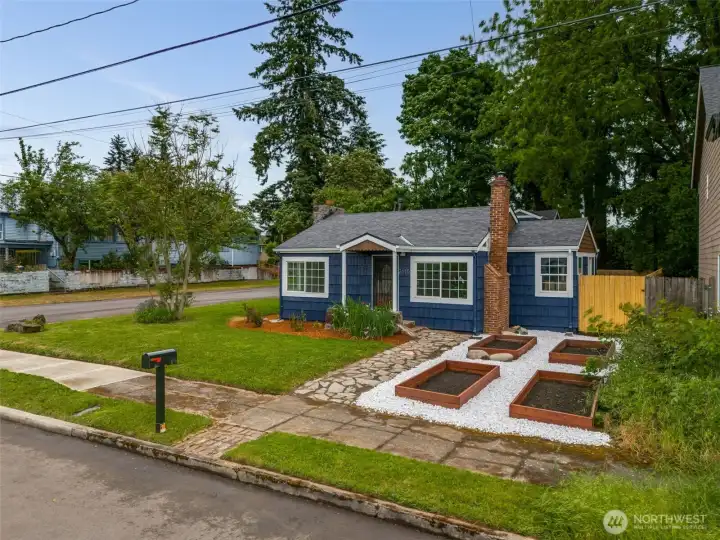 large corner lot garden beds facing west