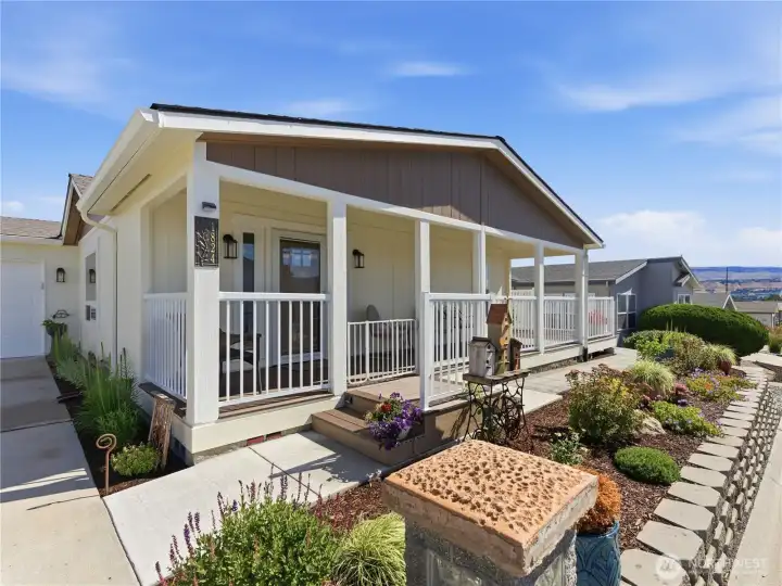 Updated front porch featuring durable Trex decking, perfect for relaxing and enjoying the peaceful Heritage Haven community.