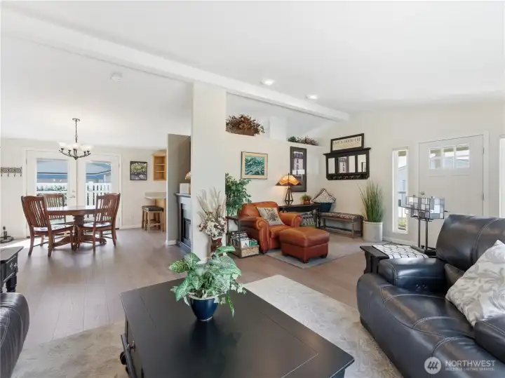 Vaulted living room designed for entertaining and relaxation with seamless flow to adjacent spaces.