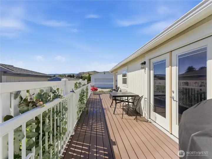 Renovated kitchen featuring updated flooring, stainless steel appliances, and ample cabinet storage.