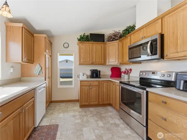 Stainless steel appliance package including updated dishwasher and microwave.