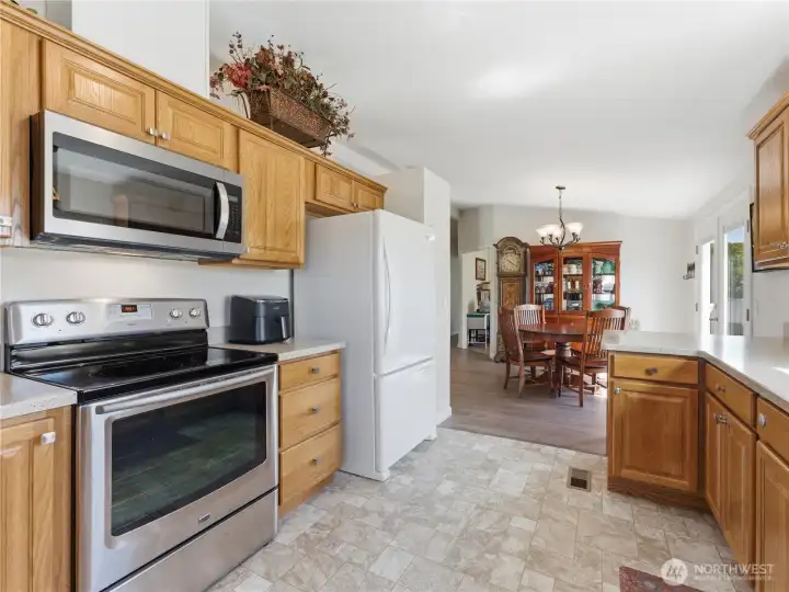 Renovated kitchen showcasing updated flooring and a clean, modern aesthetic.