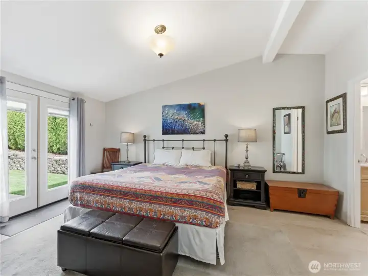 Comfortable primary bedroom retreat with updated flooring and generous space.