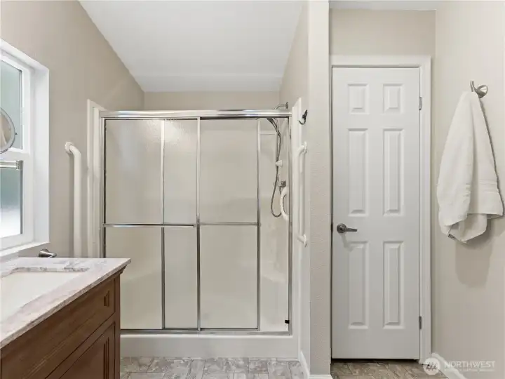 Updated primary bathroom with refreshed plumbing and functional layout.