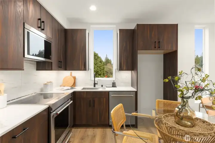 Thoughtful design meets culinary function with premium finishes, abundant prep space, and seamless integration into the home’s open layout. Thoughtful design meets culinary function with premium finishes, abundant prep space, and seamless integration into the home’s open layout.