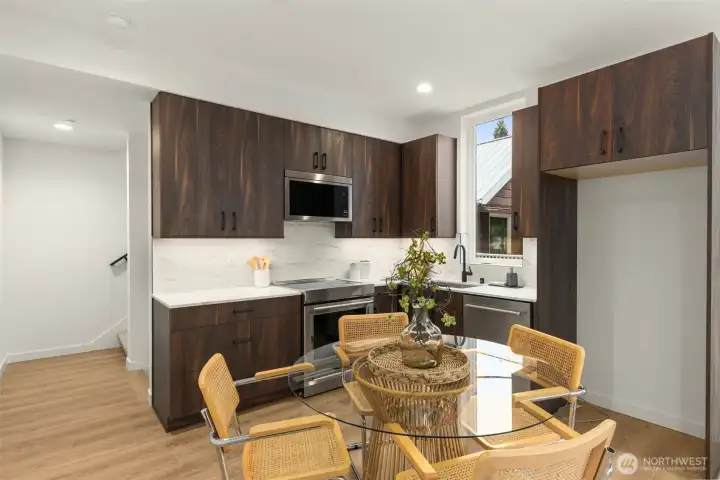 Crisp, contemporary design elements and premium modern appliances create a refined culinary backdrop. Crisp, contemporary design elements and premium modern appliances create a refined culinary backdrop.