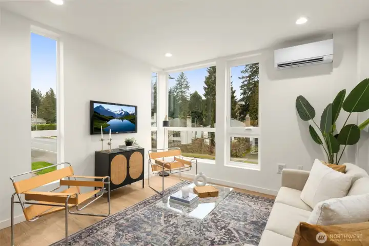 Expansive glazing frames serene neighborhood views, flooding the main living area with warmth and light. Expansive glazing frames serene neighborhood views, flooding the main living area with warmth and light.