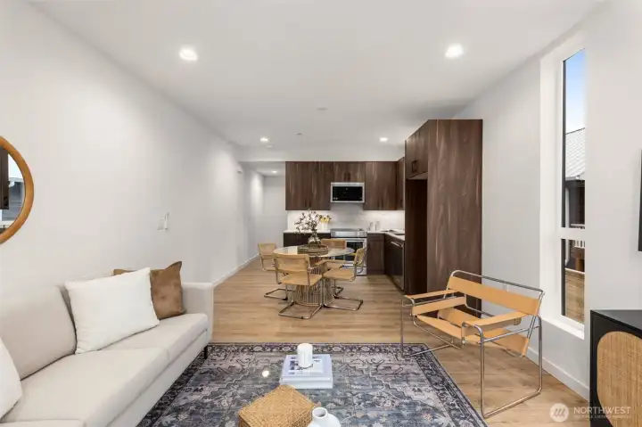 A beautifully proportioned entertaining space grounded by rich flooring, clean lines, and a warm, inviting ambiance. A beautifully proportioned entertaining space grounded by rich flooring, clean lines, and a warm, inviting ambiance.