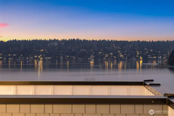 Dramatic twilight skies frame the sweeping panoramic water views, offering an unmatched backdrop for evening relaxation. Dramatic twilight skies frame the sweeping panoramic water views, offering an unmatched backdrop for evening relaxation.