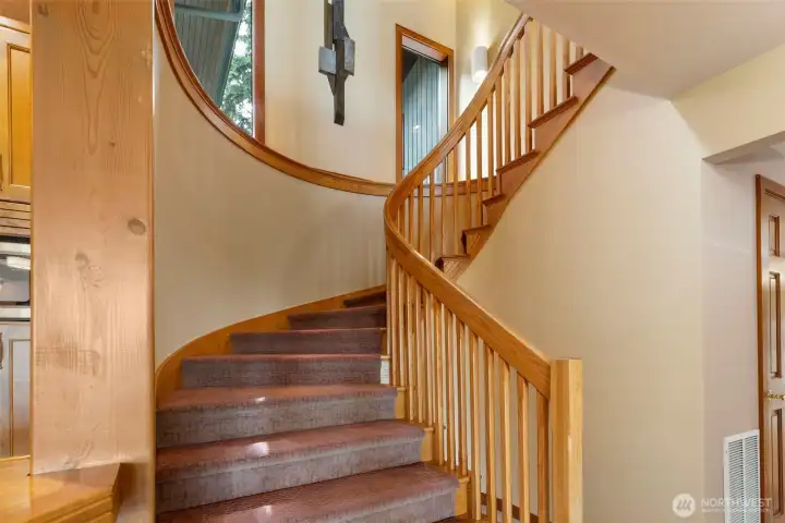 Stairs leading down lower level and additional bedrooms Stairs leading down lower level and additional bedrooms