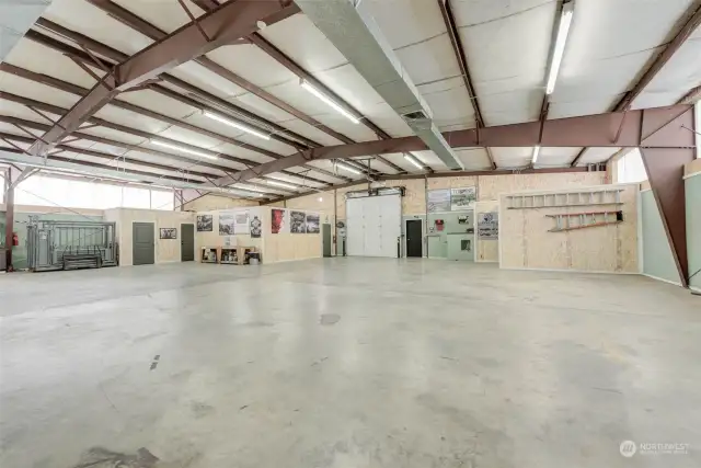 Plenty of space for whatever you might need!  Would make an amazing showroom and workspace for your call collection.  Just add a couple of lifts and a pool table!  The area at left corner is the (also heated) office and 1/2 bathroom.