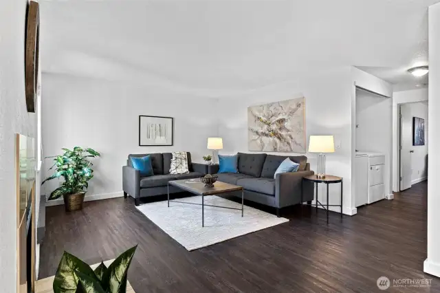 Spacious Living room looks out to yard and trees in greenbelt.