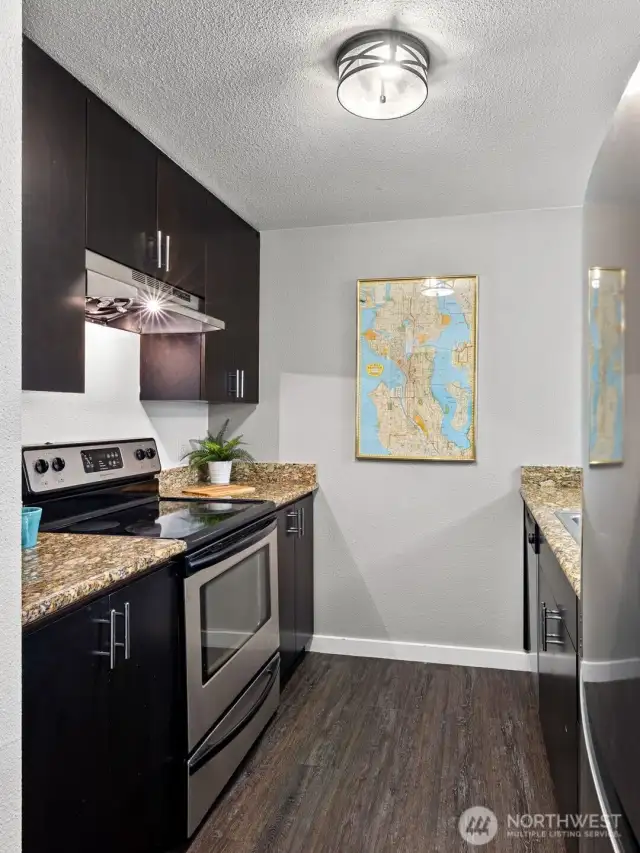Galley style Kitchen with newer appliances and granite counters