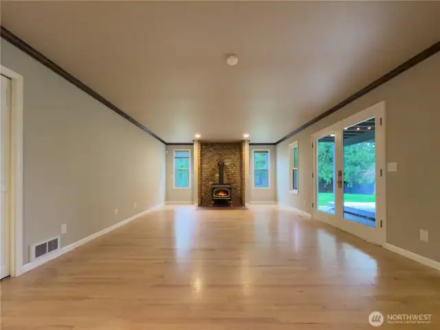 Family room off the kitchen leading to an 'all season' covered patio & big fenced backyard.