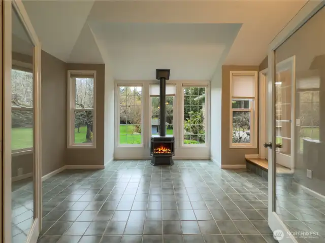 Bright & airy sun room with gas fireplace.