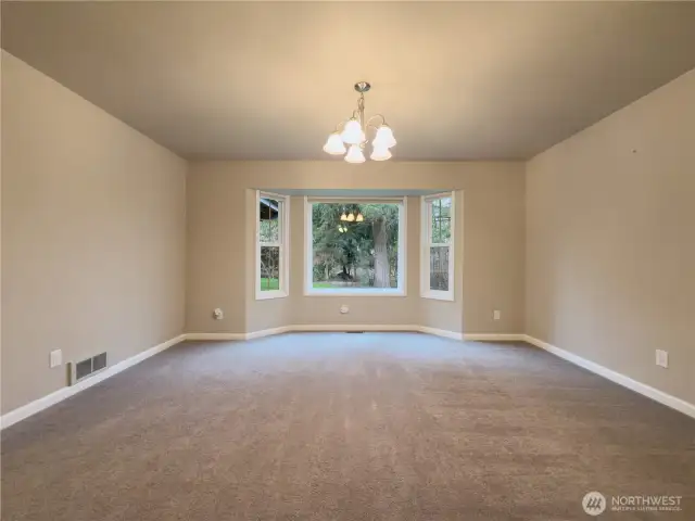 Dining room with picture window looking into the large backyard