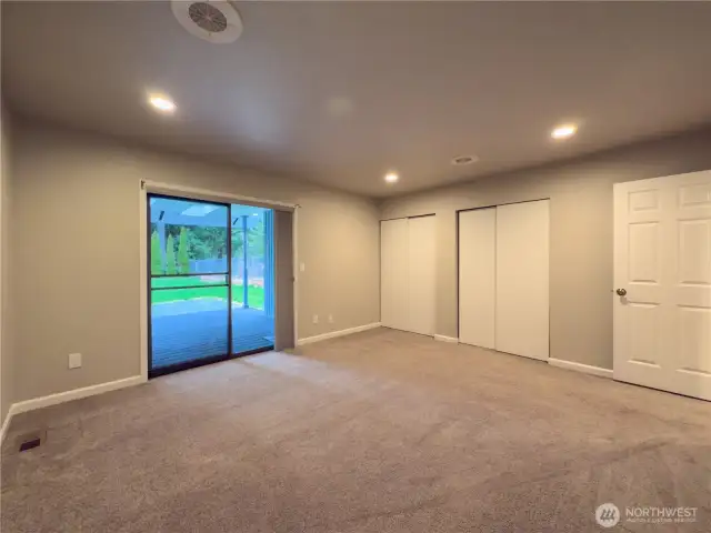 Very spacious main floor bedroom with private slider out to the sideyard. Double closets