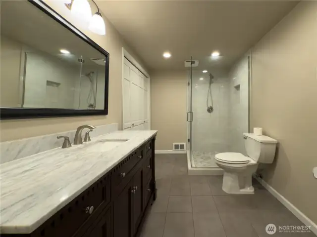 Updated main floor 3/4 bath with beautiful stone work.