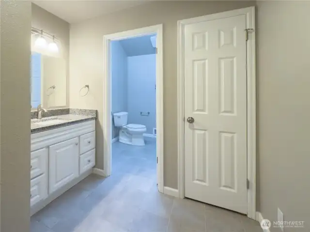 2nd floor full bath with privacy & lots of storage.