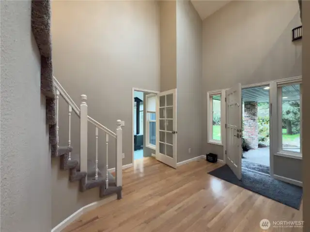 Grand front foyer with soaring ceiling.