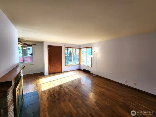 Bright hardwood living area-earm, welcoming, and full of charm living area