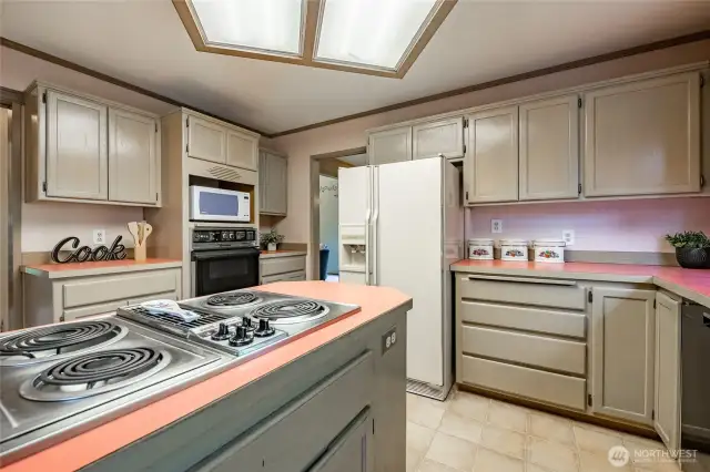 Kitchen features an island and pantry