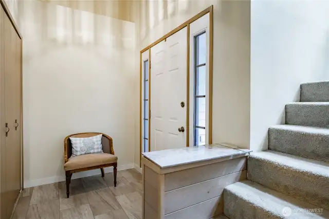 Entry with 2-story ceiling and coat closet