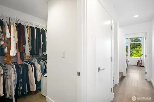 The third level is the primary suite with walk-in closet, bathroom and primary bedroom.