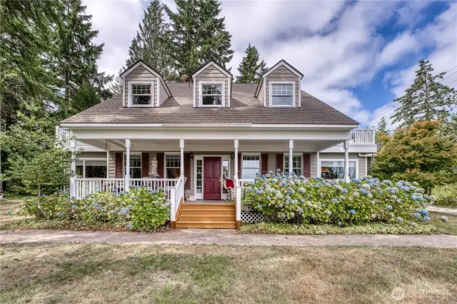 Welcome home to 10295 NE West Kingston Road! Beautiful private home situated on the Peninsula lagoon with stairs down to your dock.