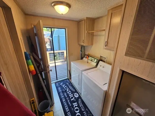 The utility room has a door to the back deck.  Washer and dryer stay!