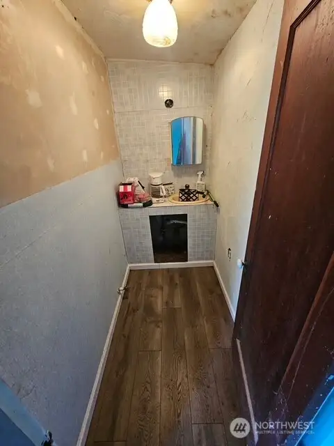 Bathroom with sink and plumbed for future fixtures.