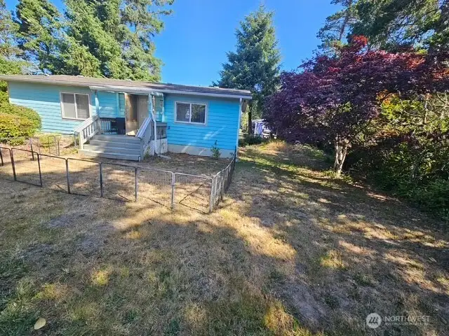 Side yard at the back of the lot.