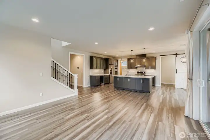 Great room flows seamlessly into dining and kitchen areas.