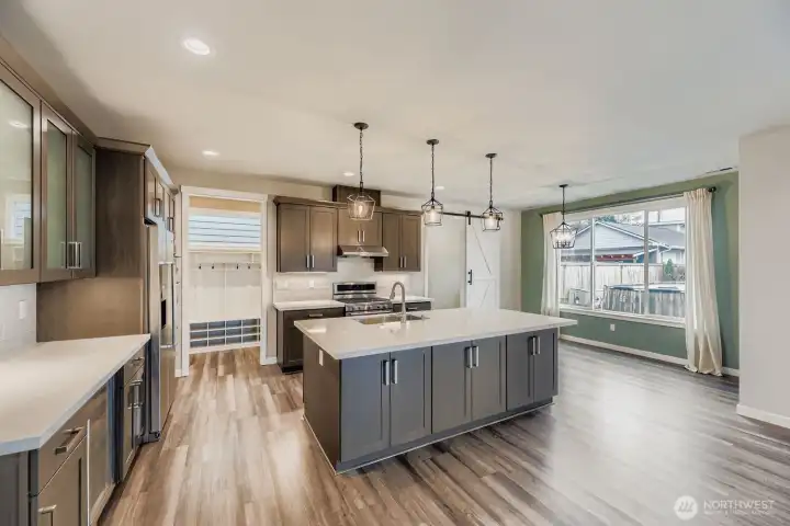 Ample counter space and cabinetry in kitchen.