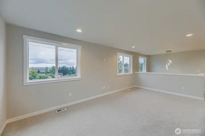 Rec room windows capture Sound and Olympic Mountain vistas.