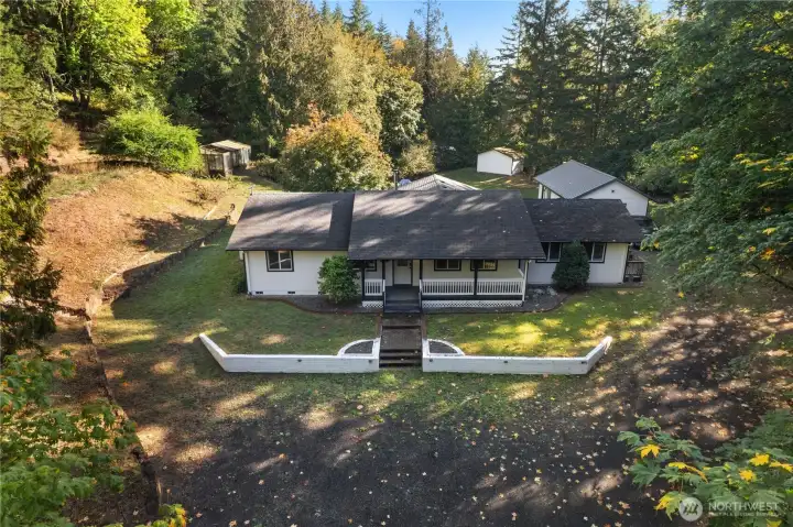 A nice private country property, with a garage/workshop, 2nd workshop, and a greenhouse!