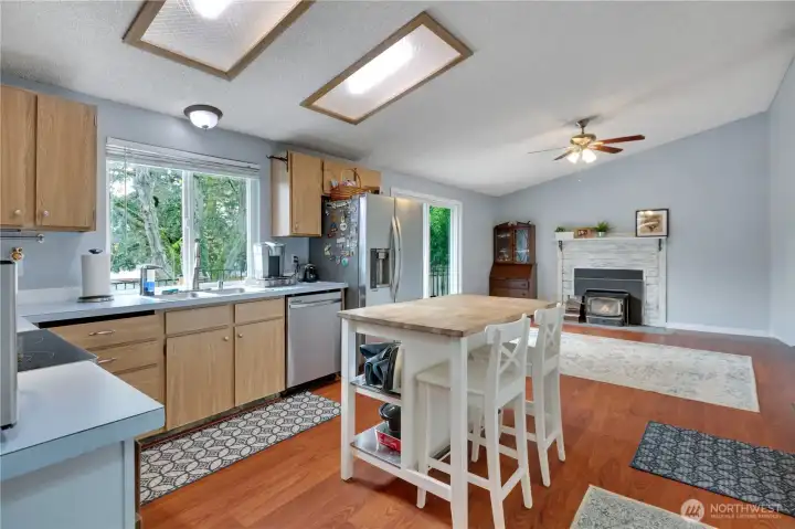 From dining room, take a right into your kitchen, and take a look at the open concept that flows right into the family room.