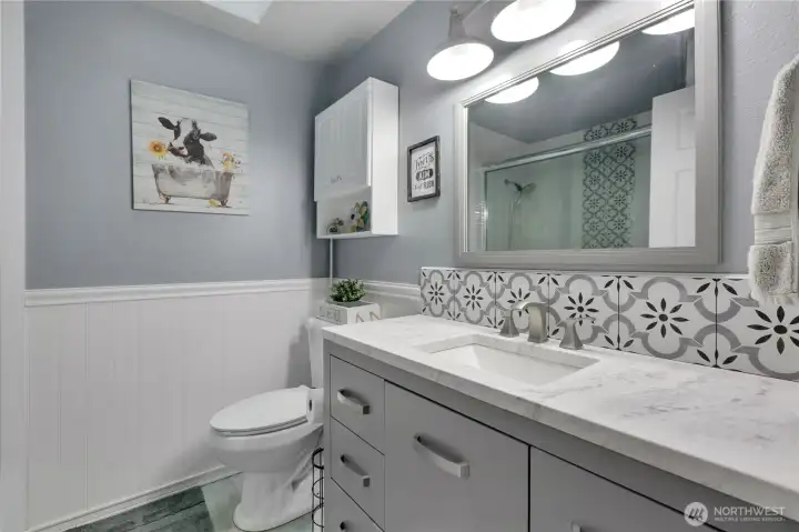Spare/guest bath is updated with lots of beautiful tile detail.