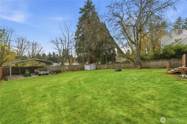 Wow, look at that yard! The car port can handle your boat or other extras you may need to store.