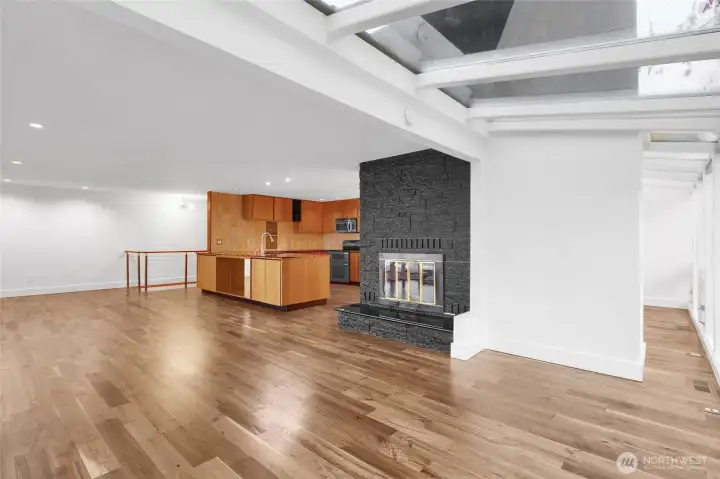 Cozy wood-burning fireplace anchors the main living space